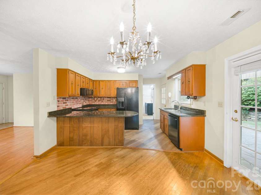 25 Mezzo Cove, Asheville, NC 28804.  MLS# CAR4308363, YatesRealty ID 13232. Dining room into kitchen