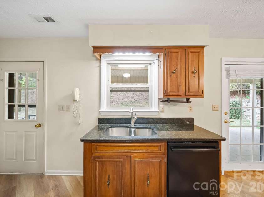 25 Mezzo Cove, Asheville, NC 28804.  MLS# CAR4308363, YatesRealty ID 13232. Kitchen window overlooking the backyard
