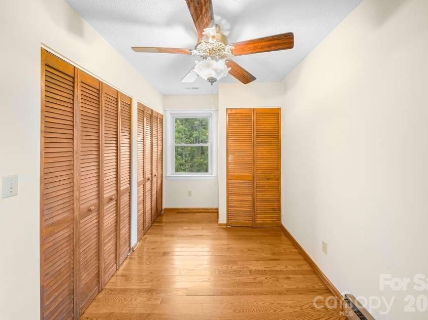 25 Mezzo Cove, Asheville, NC 28804.  MLS# CAR4308363, YatesRealty ID 13232. Primary bedroom closets