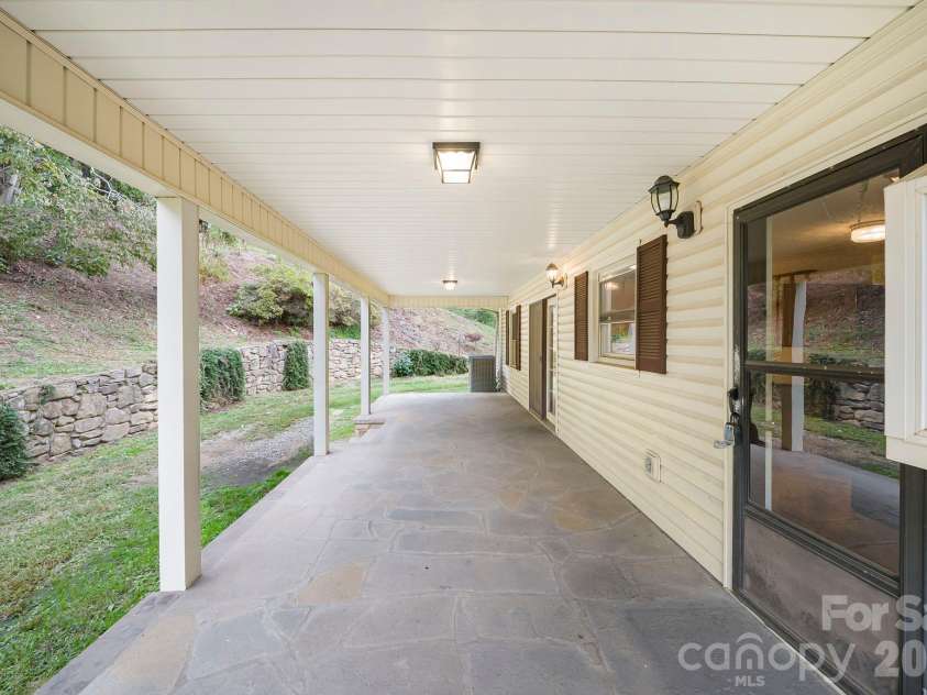 25 Mezzo Cove, Asheville, NC 28804.  MLS# CAR4308363, YatesRealty ID 13232. Stone pation