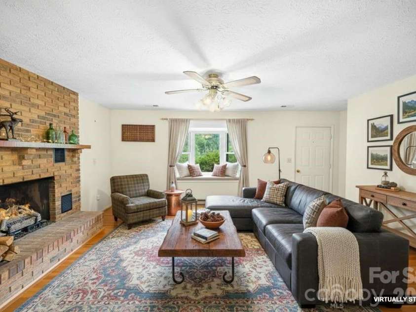25 Mezzo Cove, Asheville, NC 28804.  MLS# CAR4308363, YatesRealty ID 13232. *Virtually staged living room