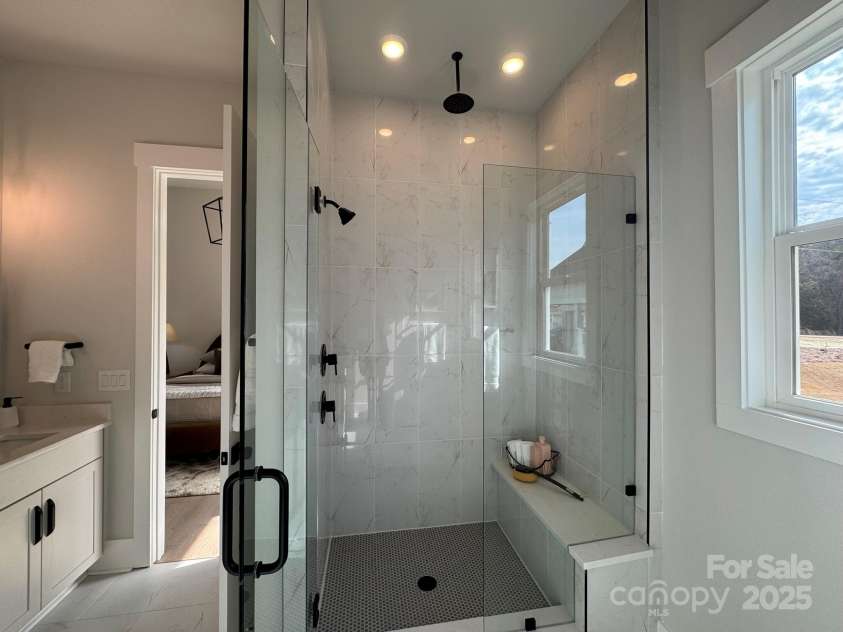 4314 Morning Mist Drive, Sherrills Ford, NC 28673.  MLS# CAR4104603, YatesRealty ID 13236. Tile Bench in Shower, Primary Bathroom, Main Floor