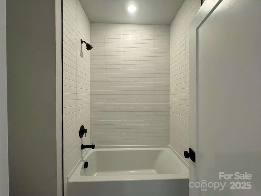 4314 Morning Mist Drive, Sherrills Ford, NC 28673.  MLS# CAR4104603, YatesRealty ID 13236. Tile Wall tub shower, upper floor