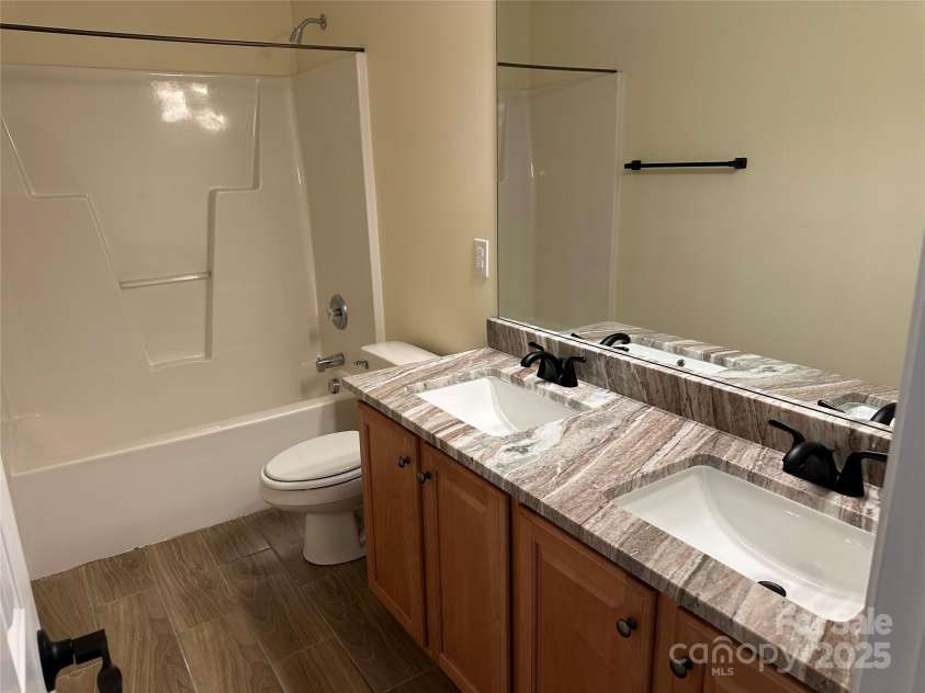 1043 Boxelder Lane, Charlotte, NC 28262.  MLS# CAR4225098, YatesRealty ID 13237. Upstairs Bathroom