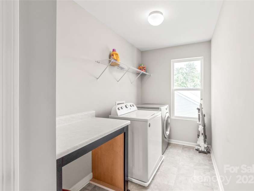 73 Sweet Peach Lane, Peachland, NC 28133.  MLS# CAR4210492, YatesRealty ID 13240. Laundry Room with Built-in Folding Table