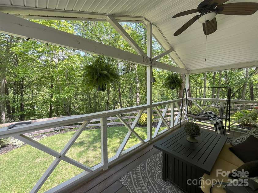 243 Buffalo Creek Road, Lake Lure, NC 28746.  MLS# CAR4219032, YatesRealty ID 13241. Covered front porch entry with plenty of room to enjoy the beauty of nature and peaceful wooded setting.