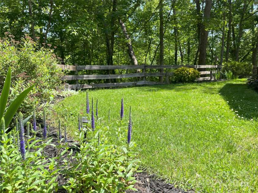 243 Buffalo Creek Road, Lake Lure, NC 28746.  MLS# CAR4219032, YatesRealty ID 13241. Level fenced-in yard area is perfect for pets and enjoying the outdoors.