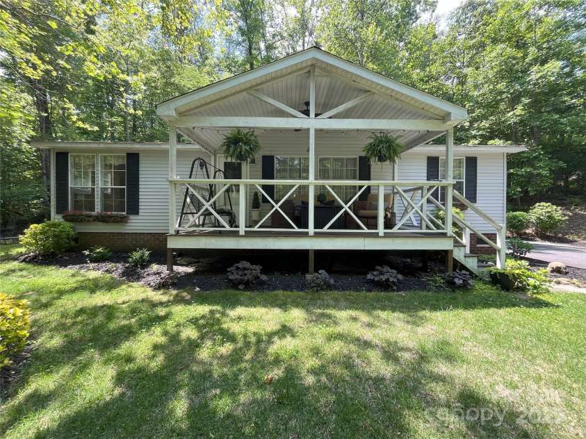 243 Buffalo Creek Road, Lake Lure, NC 28746.  MLS# CAR4219032, YatesRealty ID 13241. Updated split-floor plan home on 2 peaceful, wooded parcels, bordered by Bills Creek. Home sits up high and dry, no damage from Helene.