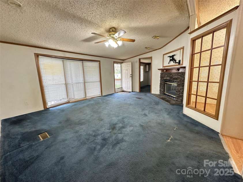 51 Kings Drive, Taylorsville, NC 28681.  MLS# CAR4245754, YatesRealty ID 13242. Large living room with fireplace