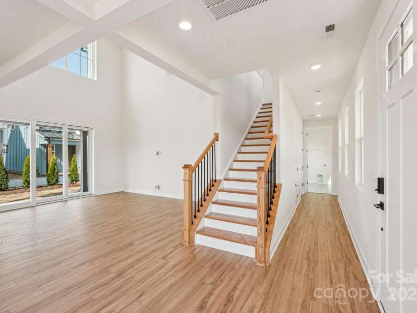 809 Terra Drive, Tega Cay, SC 29708.  MLS# CAR4195842, YatesRealty ID 13244. Stairs and View of Two-Story Great Room