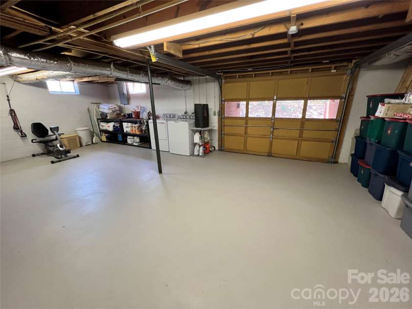24530 Ridgecrest Road, Locust, NC 28097.  MLS# CAR4369926, YatesRealty ID 13247. Basement - Garage Door