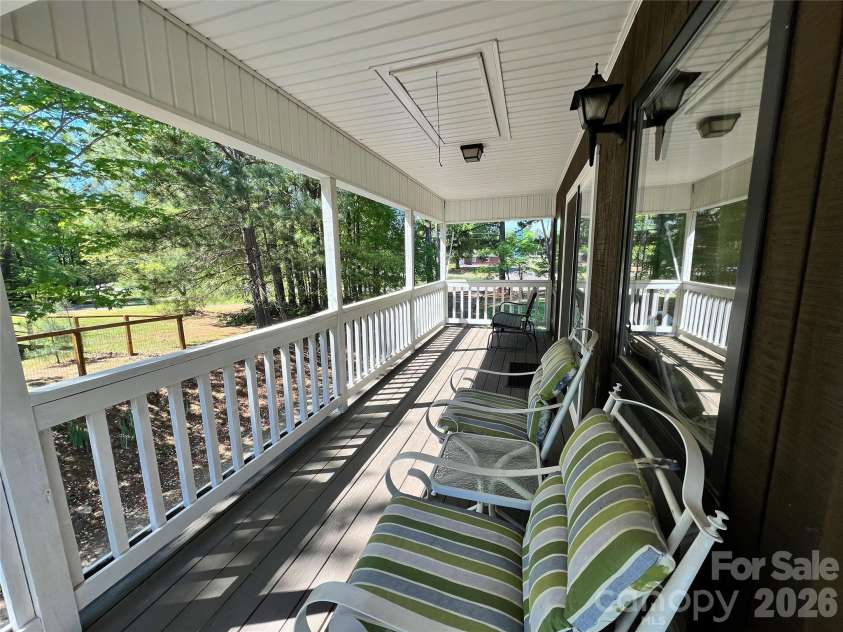 24530 Ridgecrest Road, Locust, NC 28097.  MLS# CAR4369926, YatesRealty ID 13247. Covered Side Porch 