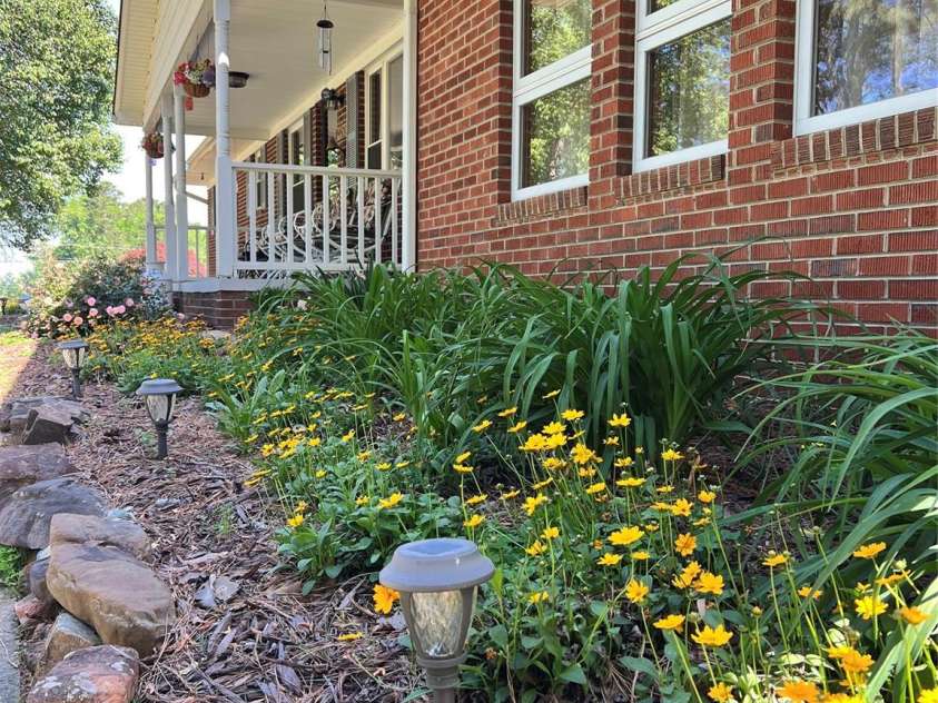 24530 Ridgecrest Road, Locust, NC 28097.  MLS# CAR4369926, YatesRealty ID 13247. Established Landscaping