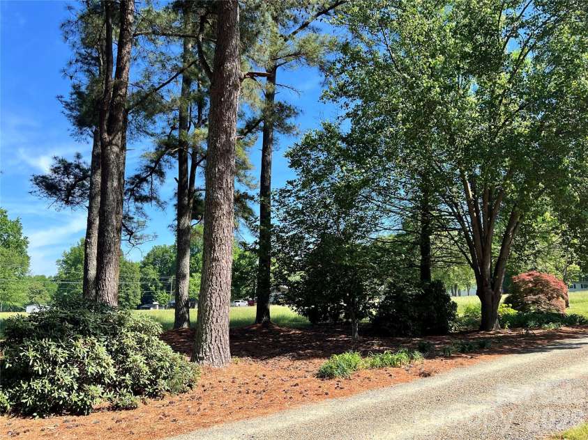 24530 Ridgecrest Road, Locust, NC 28097.  MLS# CAR4369926, YatesRealty ID 13247. Established Trees and Landscaping