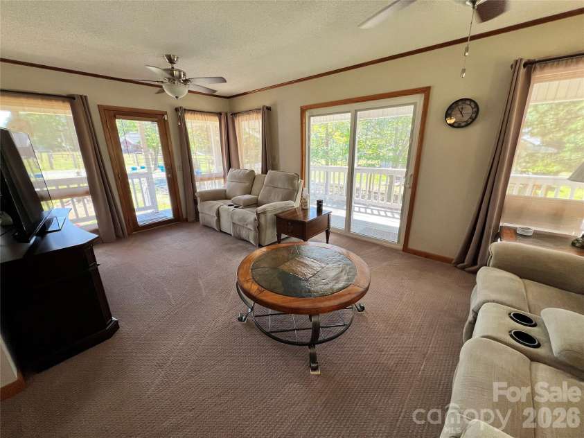 24530 Ridgecrest Road, Locust, NC 28097.  MLS# CAR4369926, YatesRealty ID 13247. Sunporch/Living Room