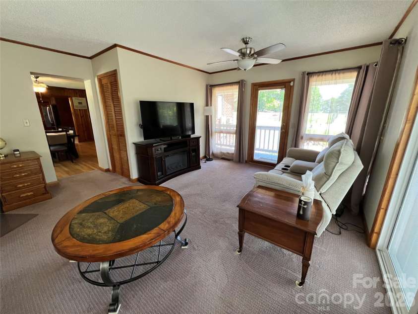 24530 Ridgecrest Road, Locust, NC 28097.  MLS# CAR4369926, YatesRealty ID 13247. Sunporch/Living Room