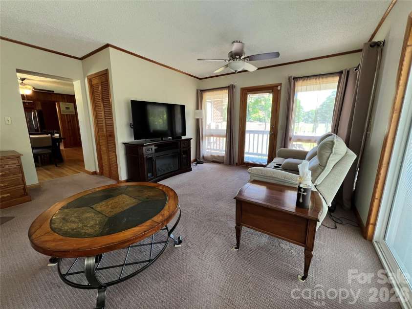 24530 Ridgecrest Road, Locust, NC 28097.  MLS# CAR4369926, YatesRealty ID 13247. Sunporch/Living Room