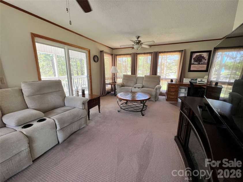 24530 Ridgecrest Road, Locust, NC 28097.  MLS# CAR4369926, YatesRealty ID 13247. Sunporch/Living Room 