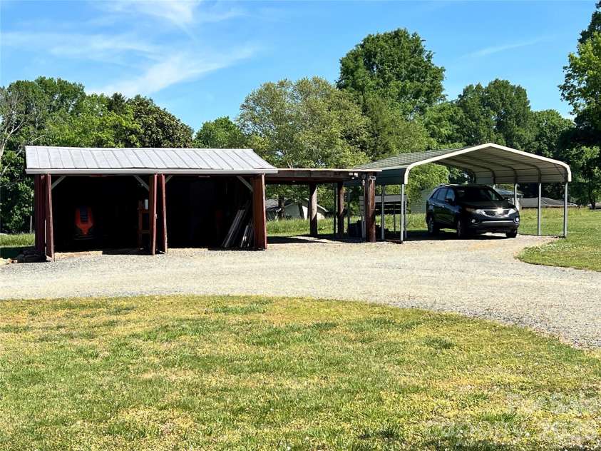 24530 Ridgecrest Road, Locust, NC 28097.  MLS# CAR4369926, YatesRealty ID 13247. Utility Shed - Carport
