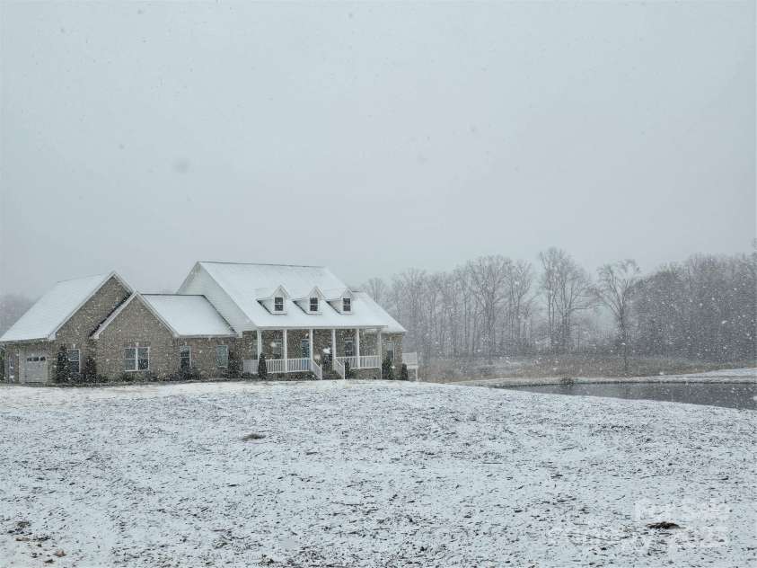 2510 Lentz Road, China Grove, NC 28023.  MLS# CAR4219428, YatesRealty ID 13250. Front view in snow