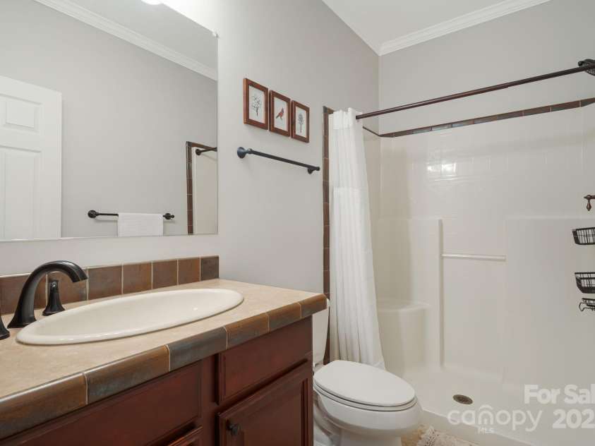 28 Back Stage Pass, Canton, NC 28716.  MLS# CAR4284833, YatesRealty ID 13277. Guest shower with tile flooring