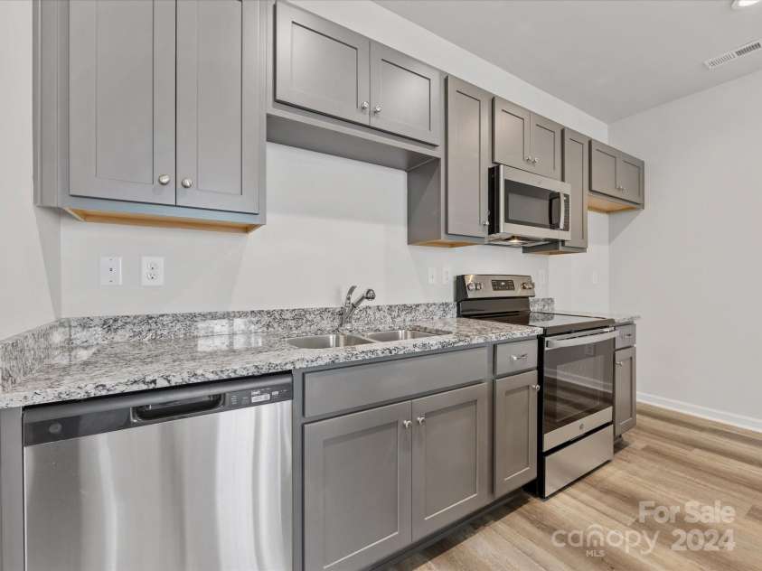 1012 Ribbon Lane, Charlotte, NC 28205.  MLS# CAR4162618, YatesRealty ID 1328. Similar build - interior colors and finishes may vary.