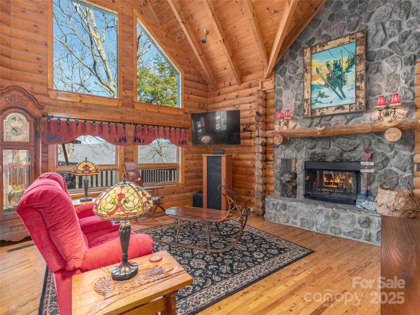 35 Falcon Crest Loop, Maggie Valley, NC 28751.  MLS# CAR4237767, YatesRealty ID 13282. Wood-burning stone FP