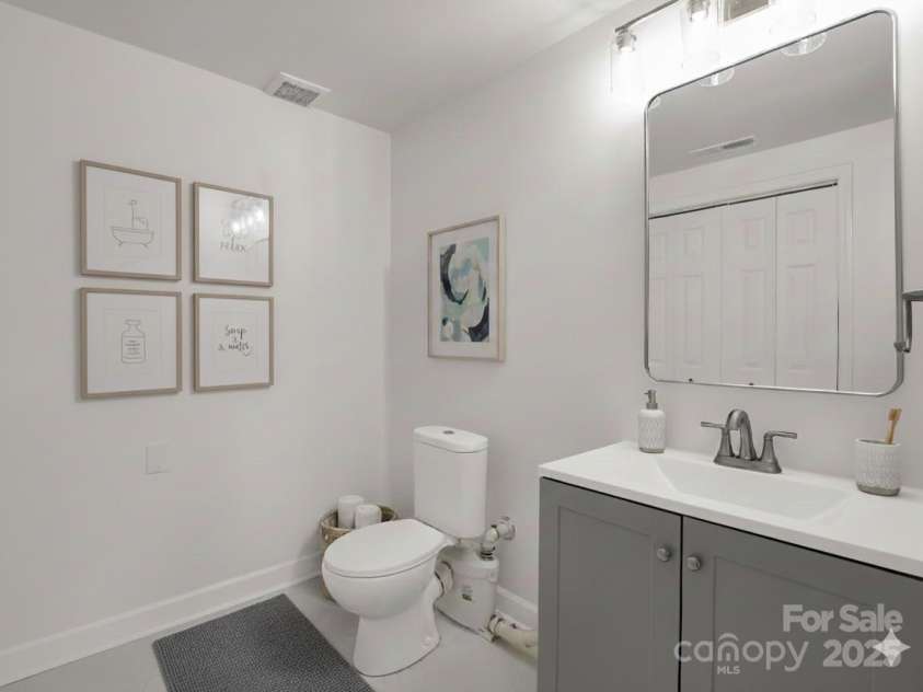 30 Patti Drive, Fletcher, NC 28732.  MLS# CAR4296193, YatesRealty ID 13283. Half bath in basement. (Virtually Staged)
