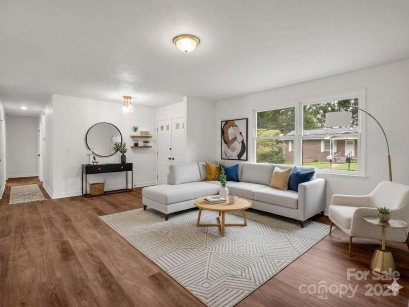 30 Patti Drive, Fletcher, NC 28732.  MLS# CAR4296193, YatesRealty ID 13283. Spacious + light filled living room. (Virtually Staged)