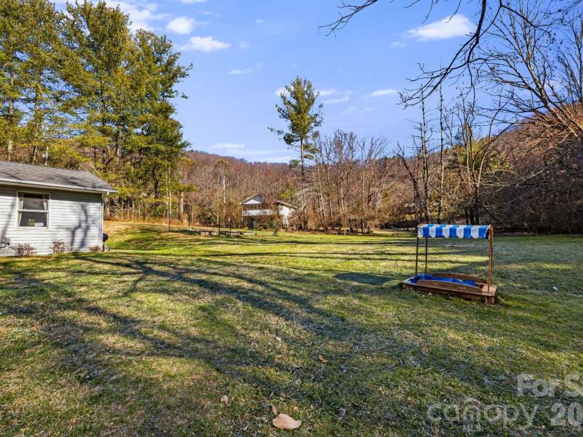 1590 Bruce Road, Mars Hill, NC 28754.  MLS# CAR4340824, YatesRealty ID 13285. Large, flat backyard