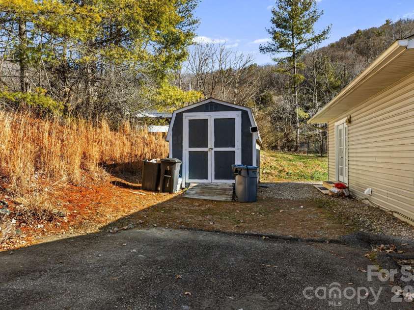 1590 Bruce Road, Mars Hill, NC 28754.  MLS# CAR4340824, YatesRealty ID 13285. Side shed conveys