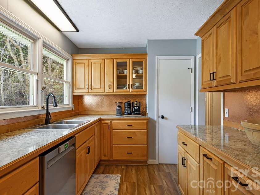 1590 Bruce Road, Mars Hill, NC 28754.  MLS# CAR4340824, YatesRealty ID 13285. Wash dishes while overlooking your yard