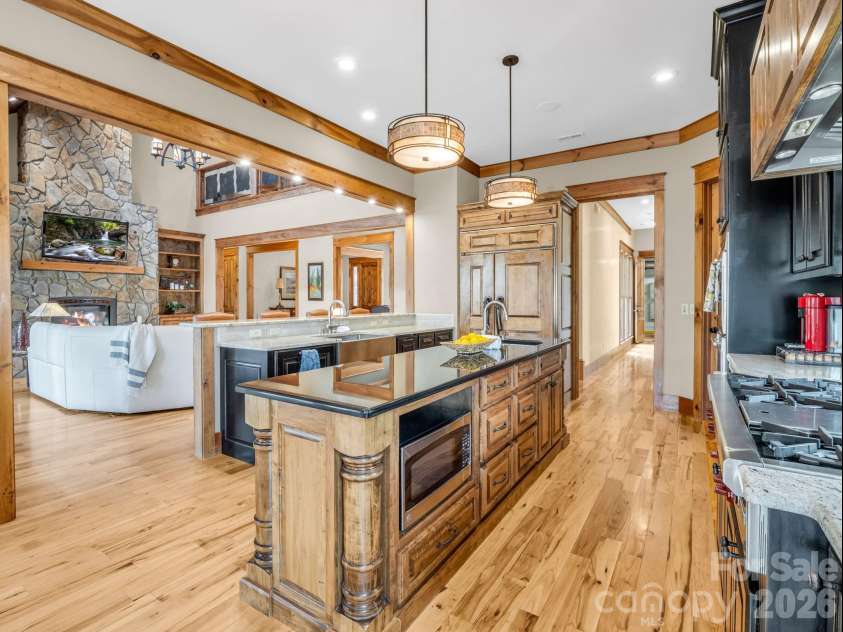 27 Anchor Drive, Nebo, NC 28761.  MLS# CAR4363728, YatesRealty ID 13289. Chef's kitchen includes Wolf six burner gas range with pot filler, Wolf double ovens, Sub-Zero refrigerator, wine cooler, Bosch dishwasher and built-in microwave.