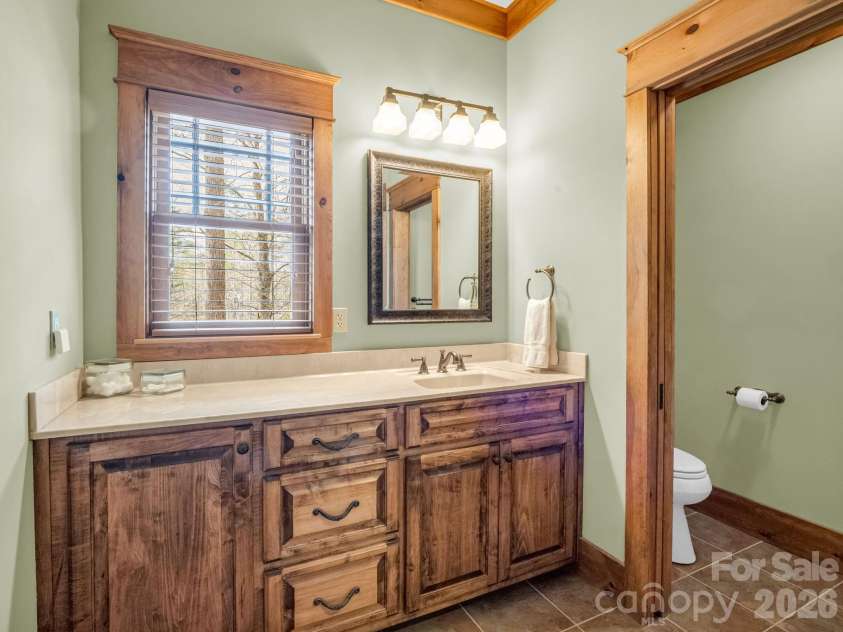 27 Anchor Drive, Nebo, NC 28761.  MLS# CAR4363728, YatesRealty ID 13289. Full guest bath on basement level.