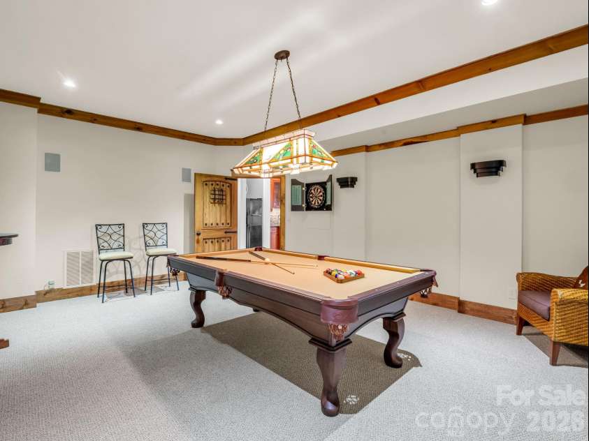 27 Anchor Drive, Nebo, NC 28761.  MLS# CAR4363728, YatesRealty ID 13289. Spacious billiard/game room on basement level.