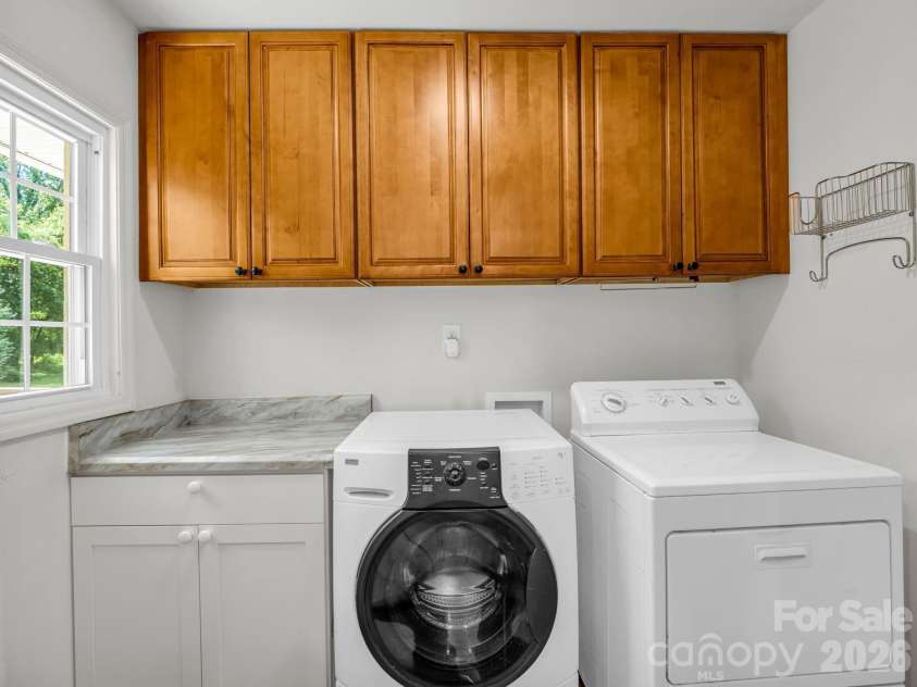 260 Warrior Drive, Tryon, NC 28782.  MLS# CAR4359501, YatesRealty ID 13291. Laundry room before you go into garage from Kitchen, utilize for pantry area, also.