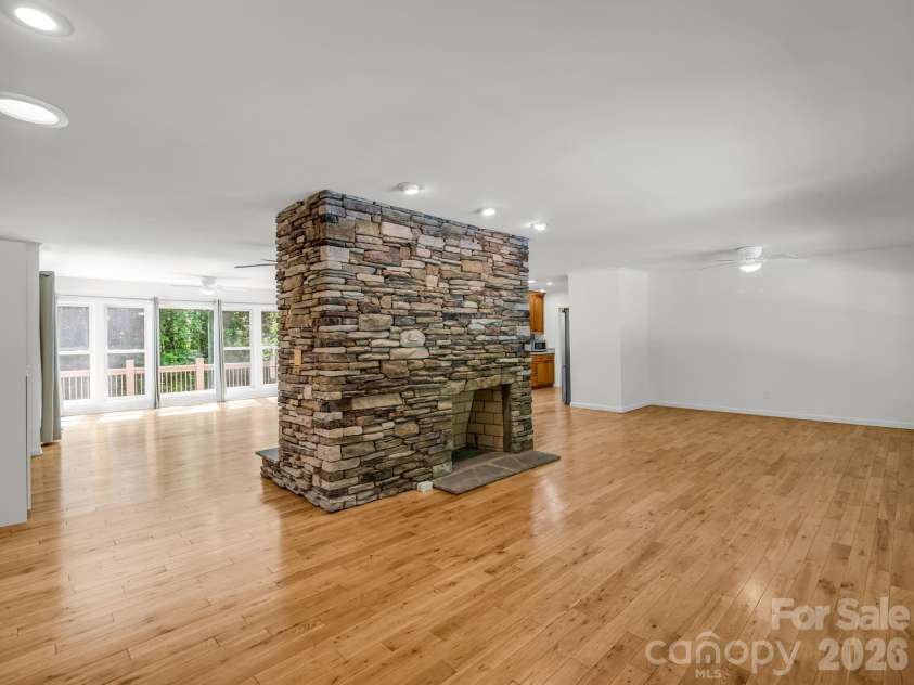260 Warrior Drive, Tryon, NC 28782.  MLS# CAR4359501, YatesRealty ID 13291. Open Floorplan with a DUAL fireplace for a centerpiece! (*Fireplace was never used, need to have checked out during DD to verify. This was for the picture only. They had an electric stove on this side. The other side may nee