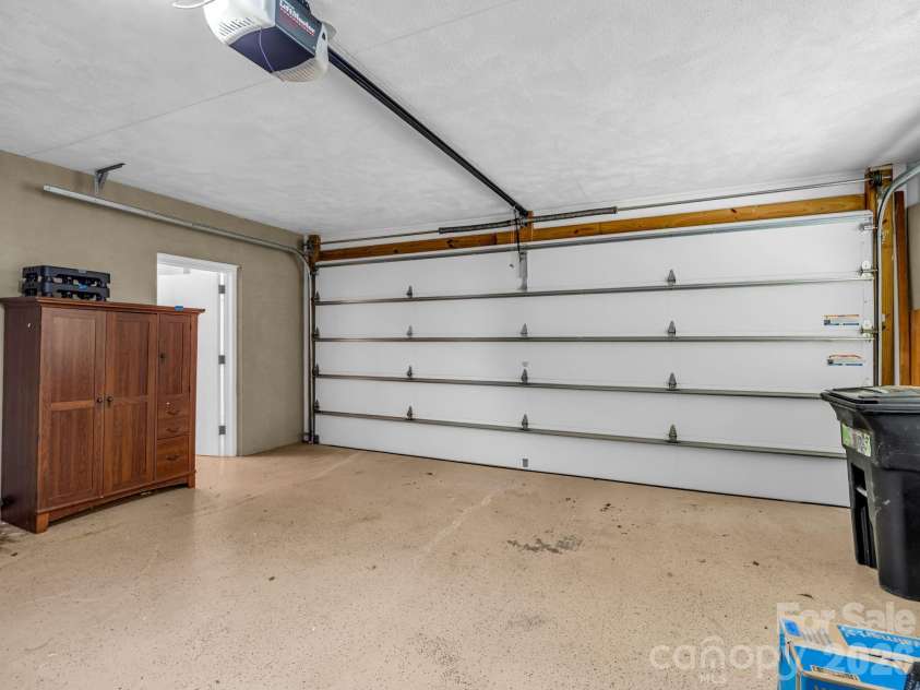 260 Warrior Drive, Tryon, NC 28782.  MLS# CAR4359501, YatesRealty ID 13291. Spacious garage with extra storage