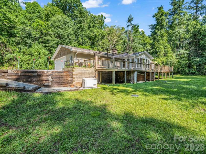 260 Warrior Drive, Tryon, NC 28782.  MLS# CAR4359501, YatesRealty ID 13291. Wonderful back yard, that's waterfront and meanders along the water!