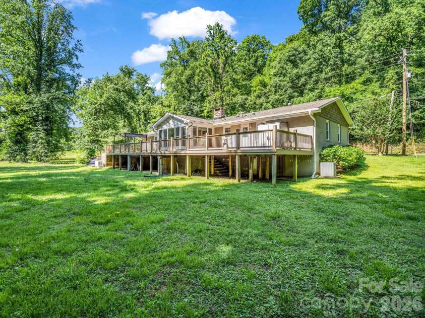 260 Warrior Drive, Tryon, NC 28782.  MLS# CAR4359501, YatesRealty ID 13291. Wonderful back yard, that's waterfront and meanders along the water!