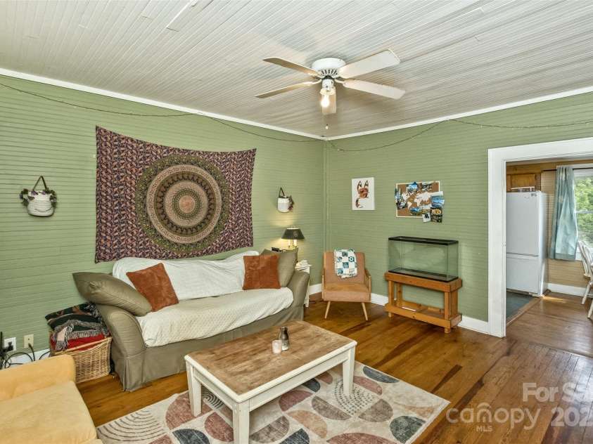 27 Townview Drive, Asheville, NC 28806.  MLS# CAR4247652, YatesRealty ID 13292. Living room features 9 ft ceilings and lots of gleaming wood floors.