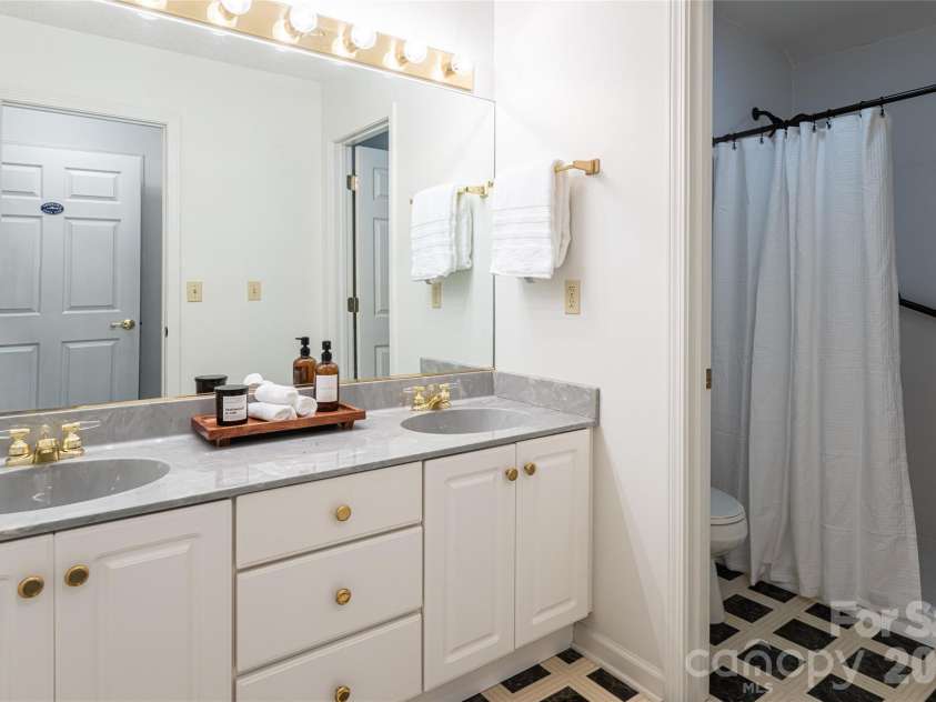 65 Timber Park Drive, Black Mountain, NC 28711.  MLS# CAR4344889, YatesRealty ID 13296. Ensuite bathroom with double vanity 