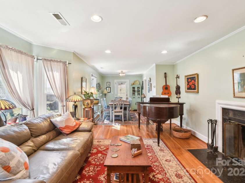 131 Ridgewood Drive, Waynesville, NC 28786.  MLS# CAR4222863, YatesRealty ID 1330. Family and dining area, highlighted by a ventless gas fireplace.