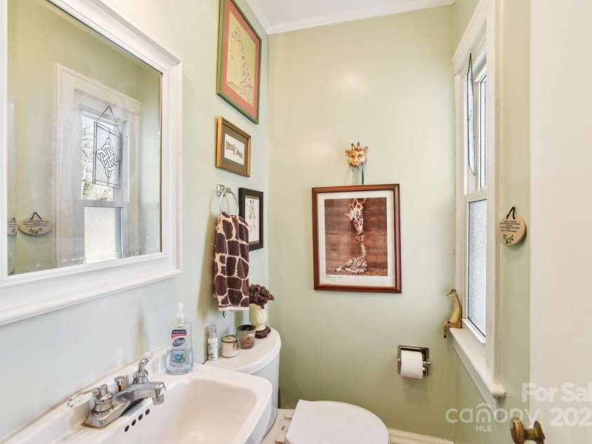 131 Ridgewood Drive, Waynesville, NC 28786.  MLS# CAR4222863, YatesRealty ID 1330. Leads past a half-bath on the left, or front, side of the house.