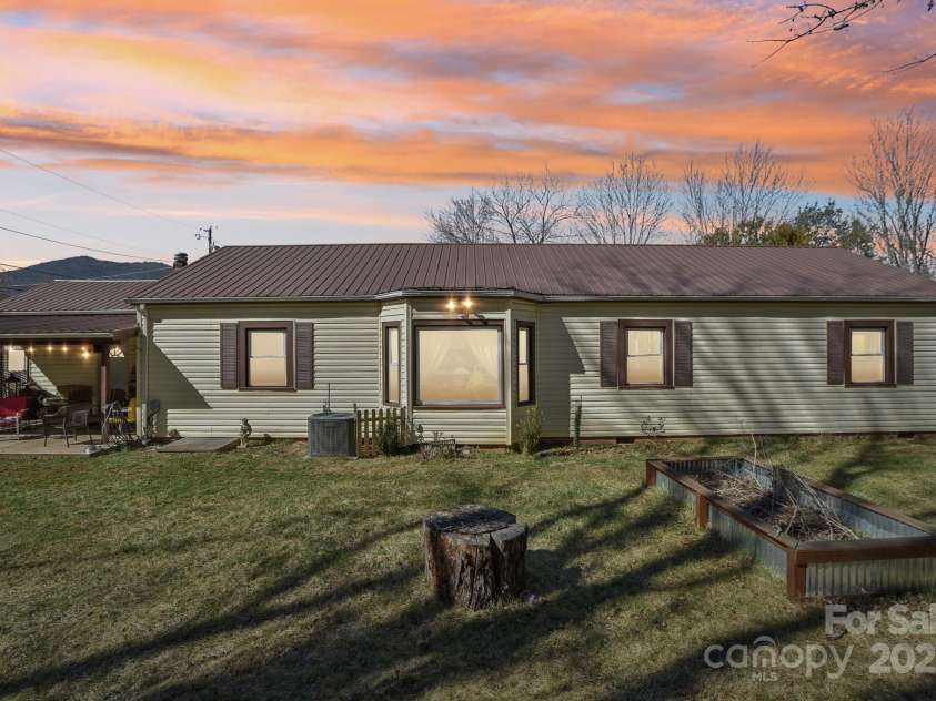 131 Ridgewood Drive, Waynesville, NC 28786.  MLS# CAR4222863, YatesRealty ID 1330. Rear View - virtual twilight