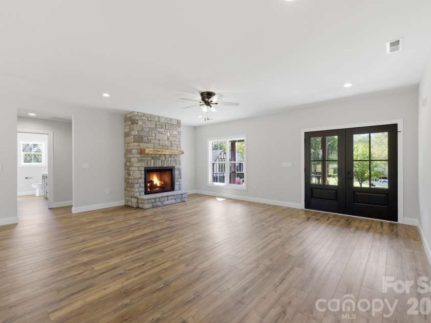 2587 Wallace Acres Lane, Lincolnton, NC 28092.  MLS# CAR4369112, YatesRealty ID 13302. Statement floor-to-ceiling stone fireplace
