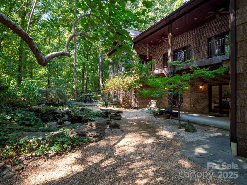 225 Riverton Road, Weddington, NC 28104.  MLS# CAR4306404, YatesRealty ID 13305. Back path with two story patio and deck