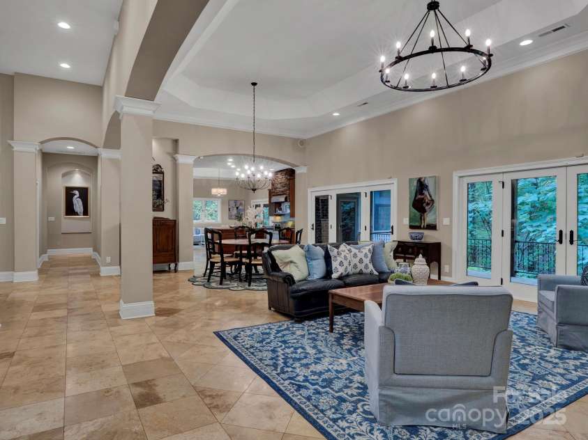 225 Riverton Road, Weddington, NC 28104.  MLS# CAR4306404, YatesRealty ID 13305. Beautiful archways, gorgeous lighting and large open glass doors leading to deck and overlooking a suite of trees
