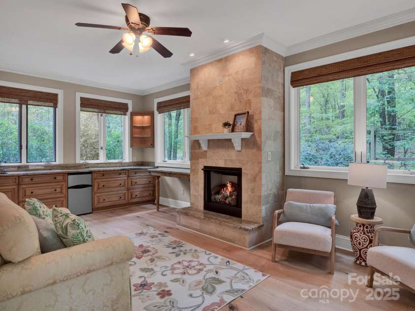 225 Riverton Road, Weddington, NC 28104.  MLS# CAR4306404, YatesRealty ID 13305. Beautiful Lower Level sitting room with gas fireplace.