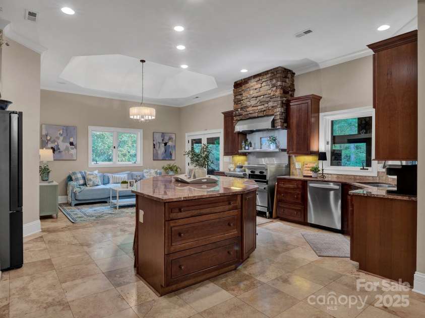 225 Riverton Road, Weddington, NC 28104.  MLS# CAR4306404, YatesRealty ID 13305. Kitchen & Hearth Room with gorgeous views to nature